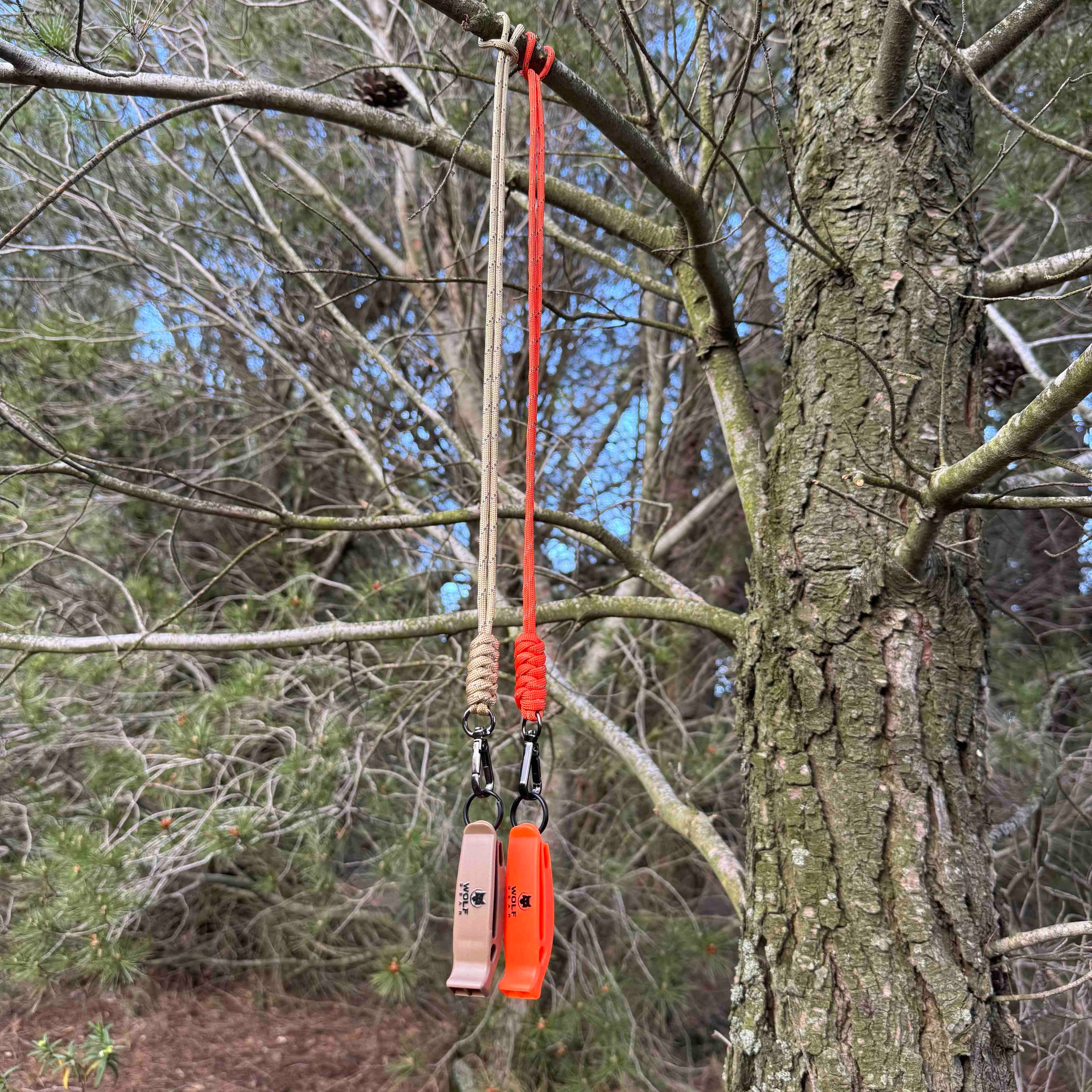 Silbato de emergencia con paracord reflectante